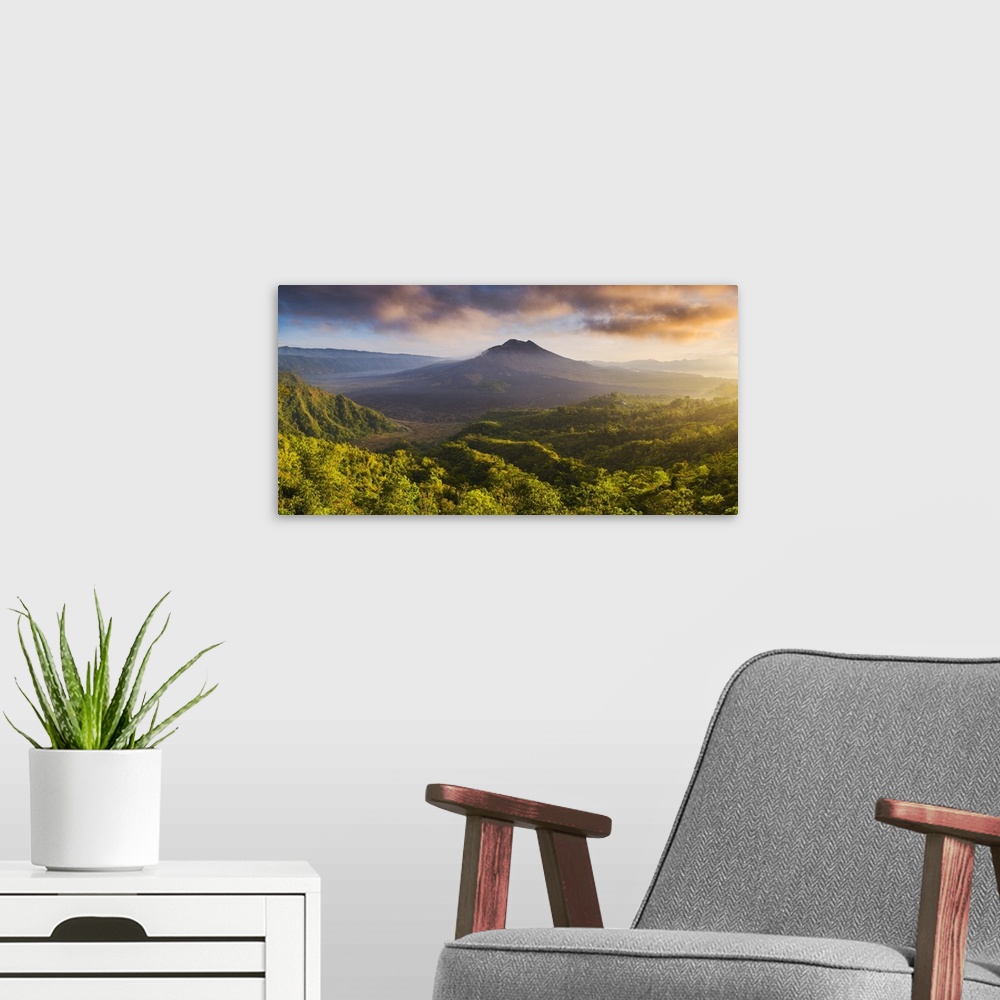 A modern room featuring Bali, Indonesia, South East Asia. Panoramic high angle view over the Mount Batur (Gunung Batur) v...