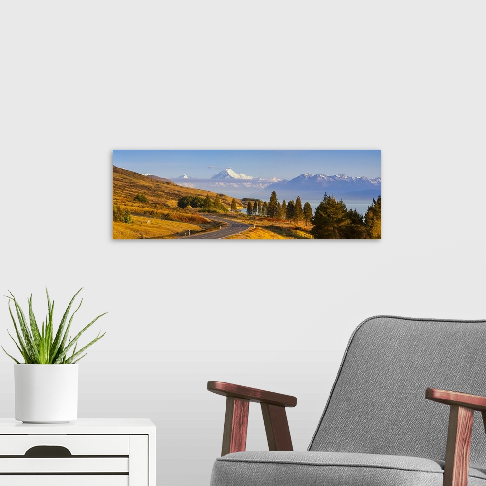 A modern room featuring Mount Cook (Aoraki) illuminated at sunrise, Lake Pukaki, Mackenzie Country, Canterbury, South Isl...