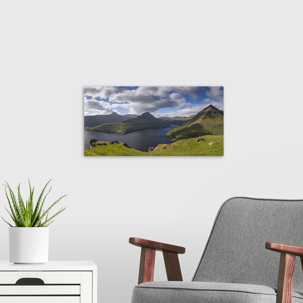 A modern room featuring Mountains surrounding Funningsfjordur on the island of Eysturoy, Faroe Islands, Denmark. Summer (...