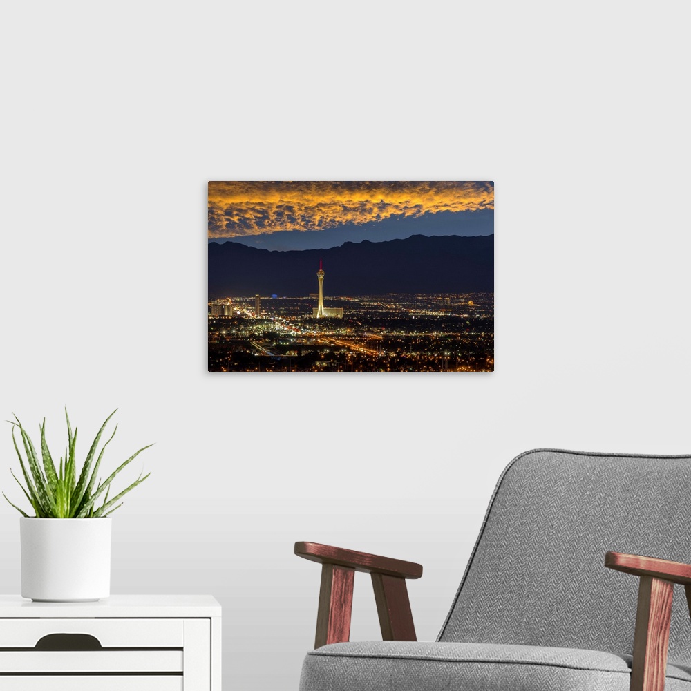 A modern room featuring USA, Nevada, Las Vegas, Stratosphere and downtown at night.