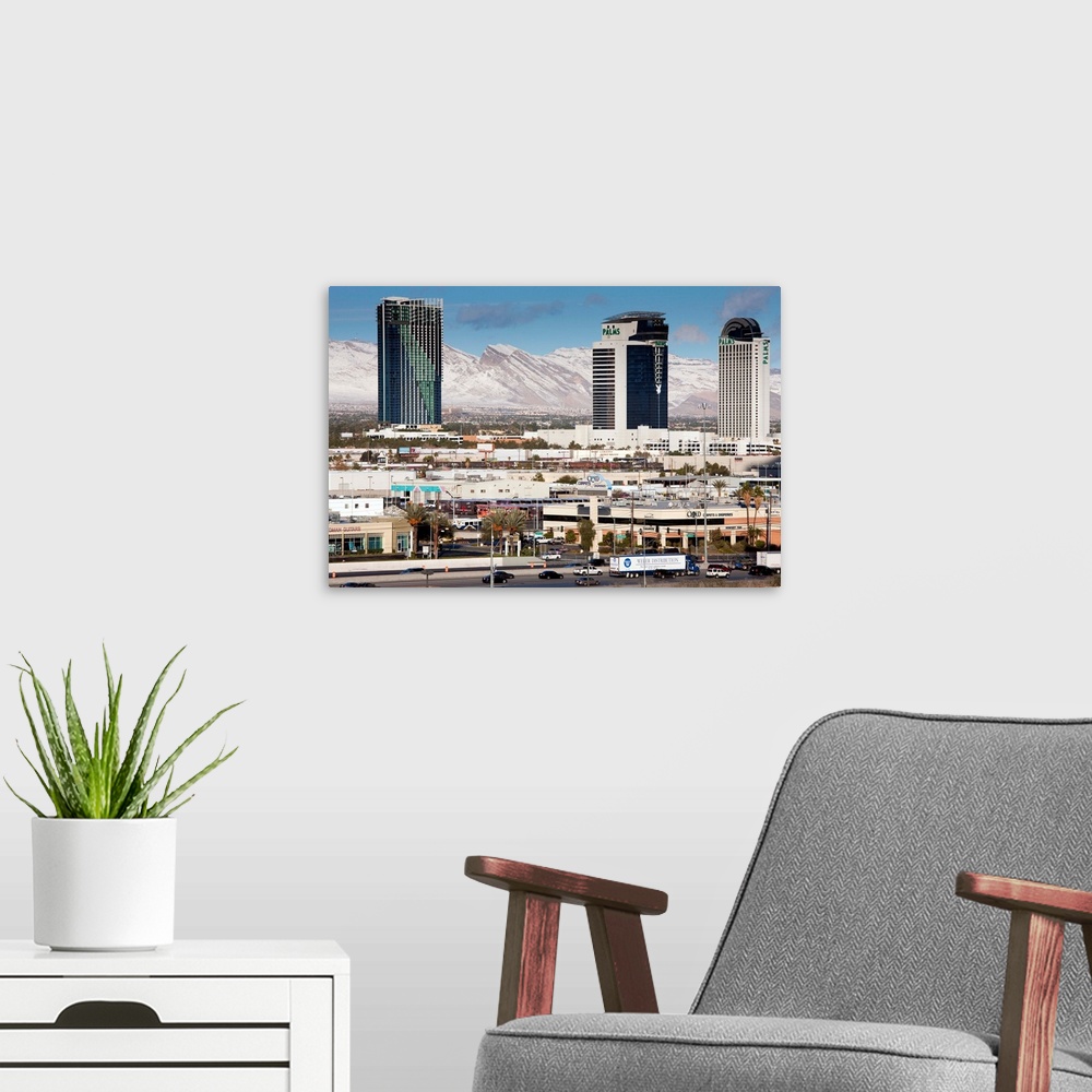 A modern room featuring USA, Nevada, Las Vegas, view west of Interstate 15 showing snow on mountains, morning