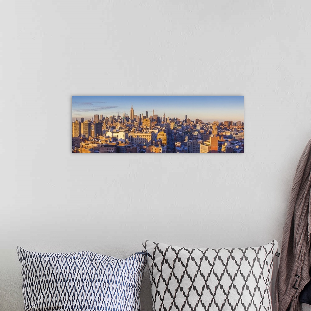 A bohemian room featuring USA, New York, New York City, Lower Manhattan, Mid-town Manhattan skyline, elevated view, sunset