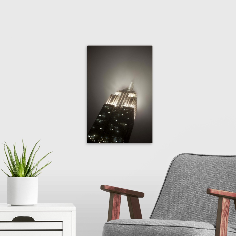 A modern room featuring USA, New York City, Manhattan, Empire State Building on a rainy evening- low angle view