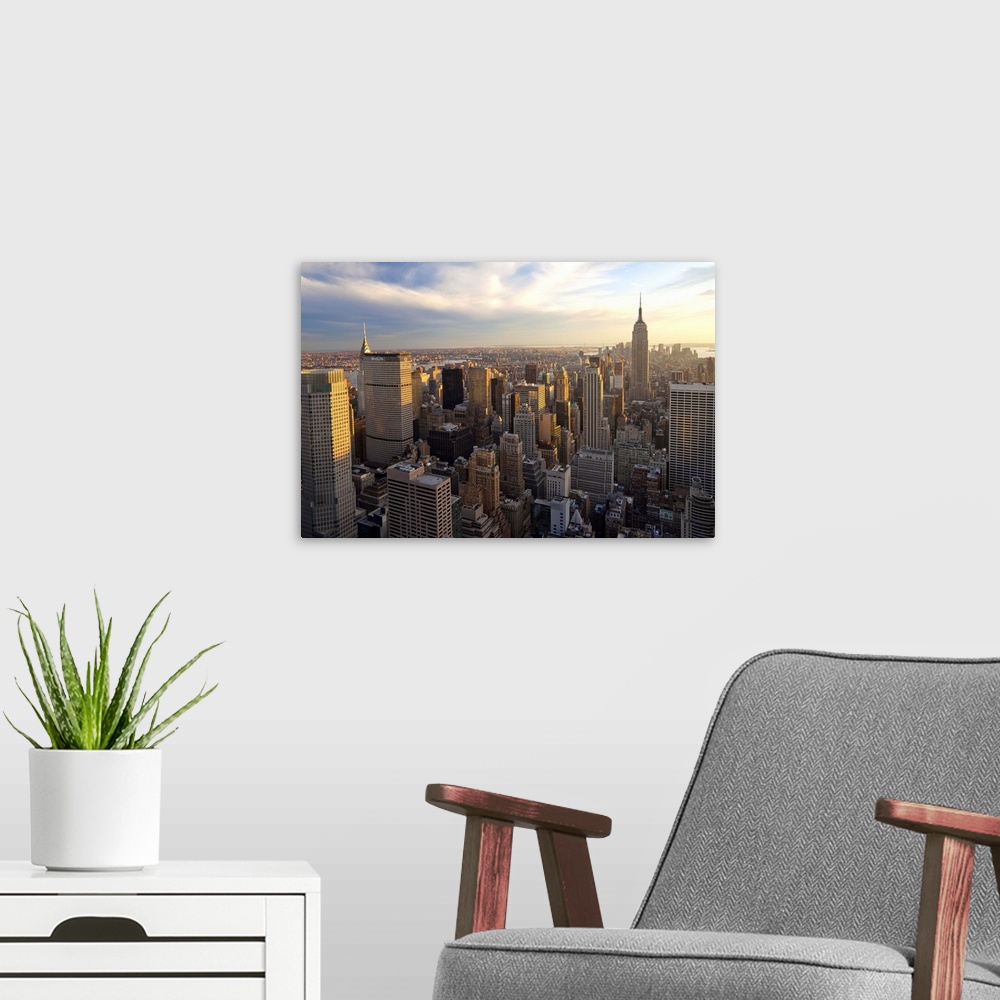 A modern room featuring USA, New York City, Manhattan,  View of Downtown Manhattan and the Empire State building from the...