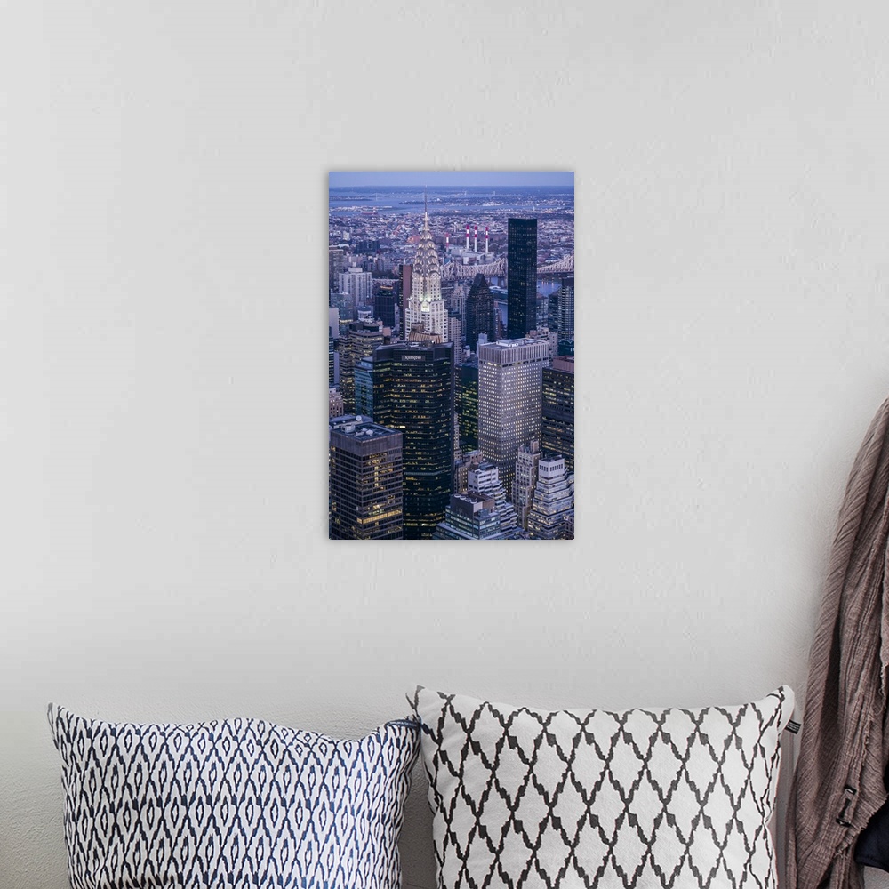 A bohemian room featuring USA, New York, New York City, Mid-Town Manhattan, elevated view towards Chrysler Building, dusk