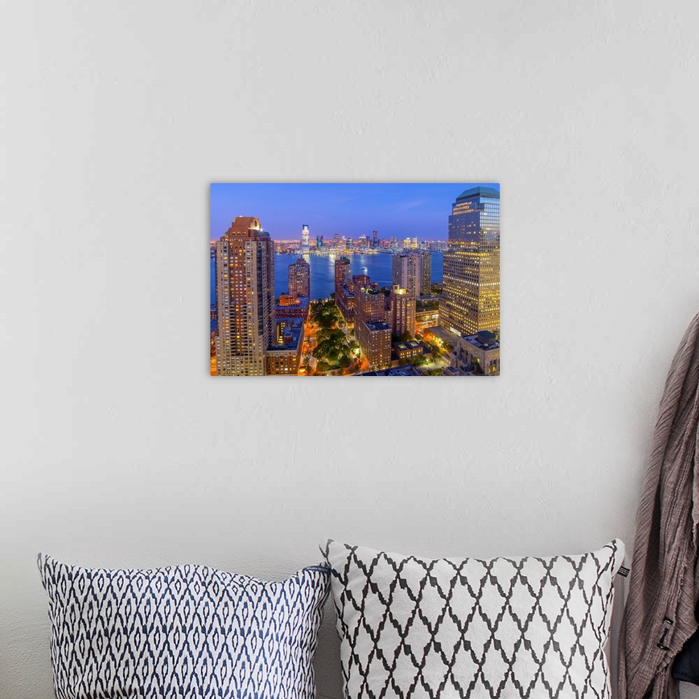 A bohemian room featuring USA, New York, Lower Manhattan, Jersey City in New Jersey across Hudson River.