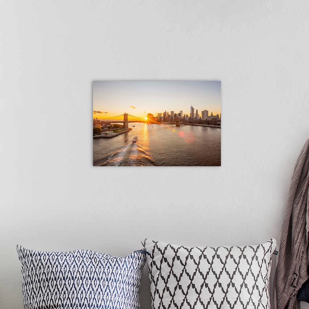 A bohemian room featuring USA, New York, Lower Manhattan Skyline and Brooklyn Bridge over East River at Sunset.