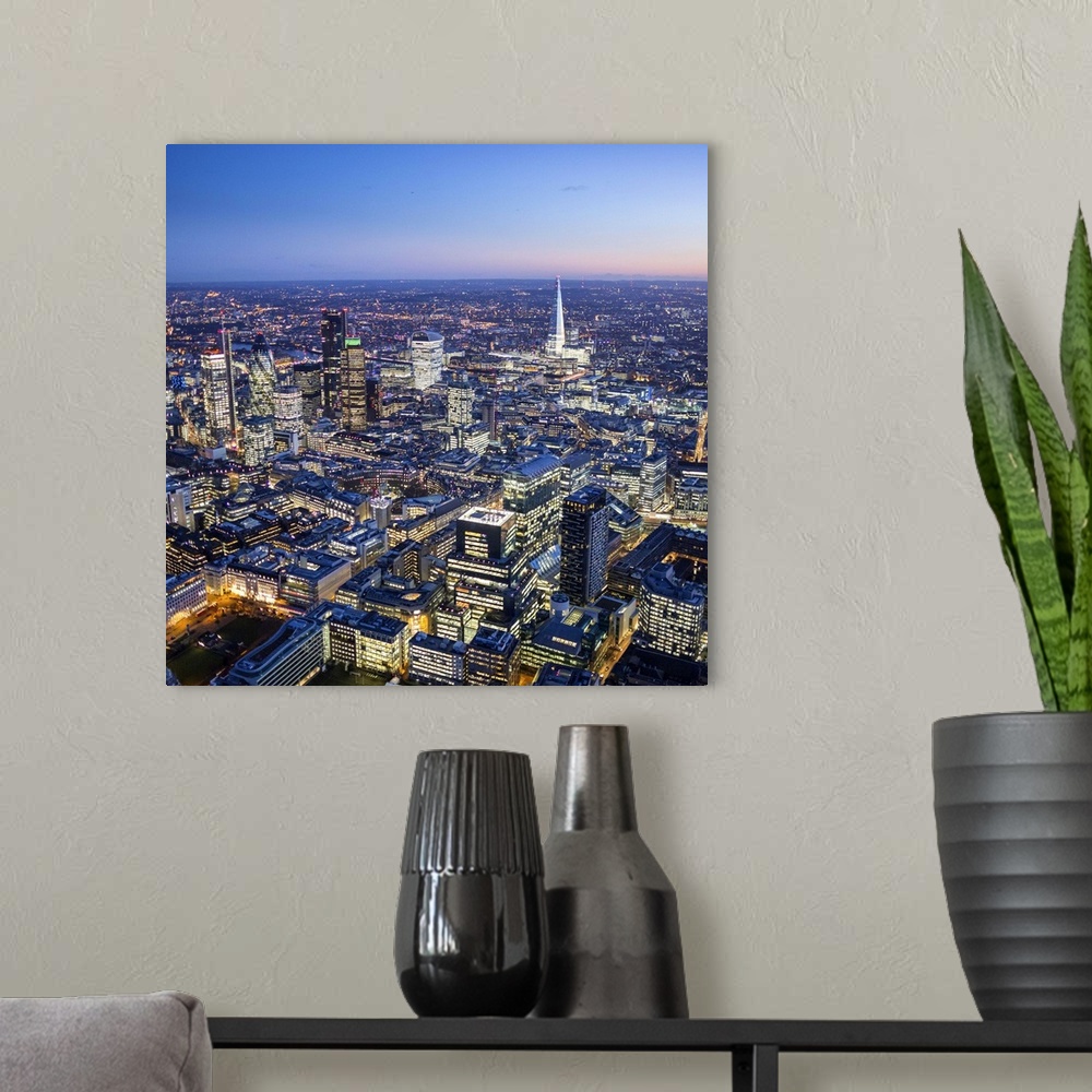 A modern room featuring Night aerial view of The Shard and City of London, London, England