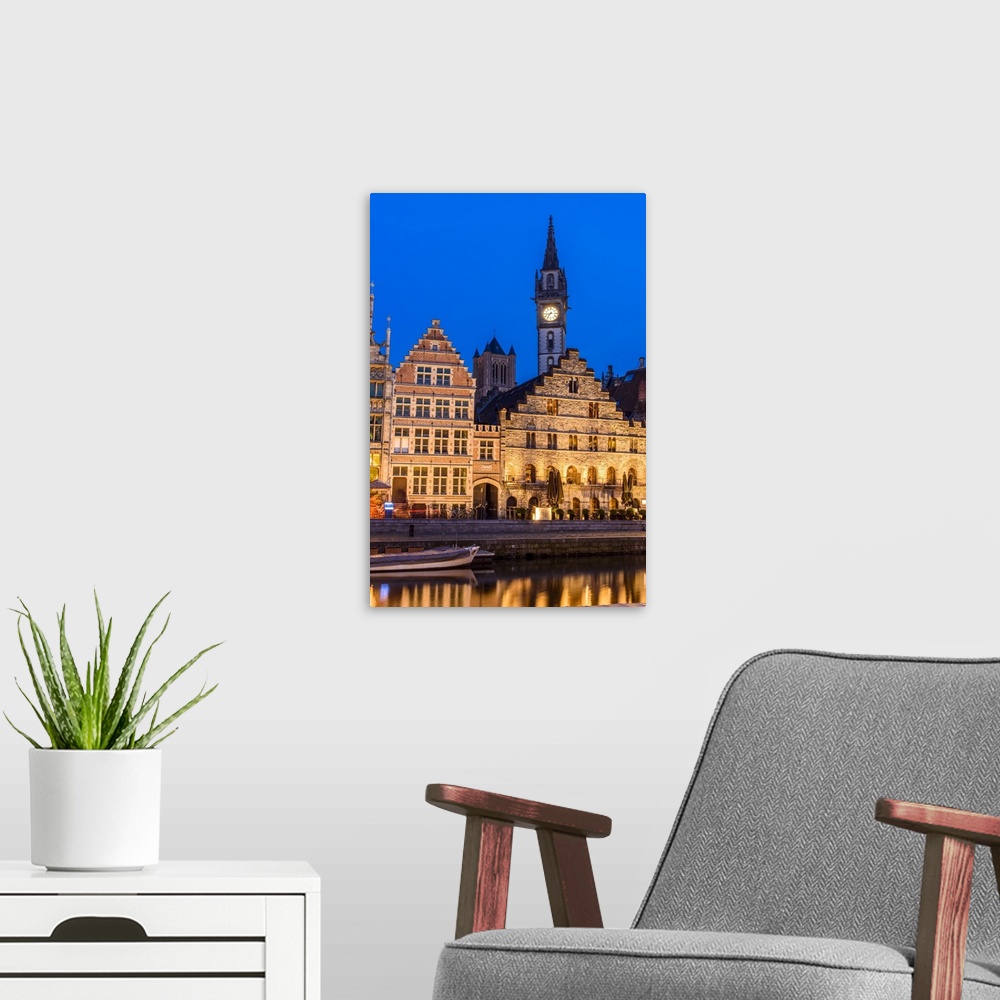 A modern room featuring Night view of Graslei quay with Post Plaza tower, Ghent, East Flanders, Belgium