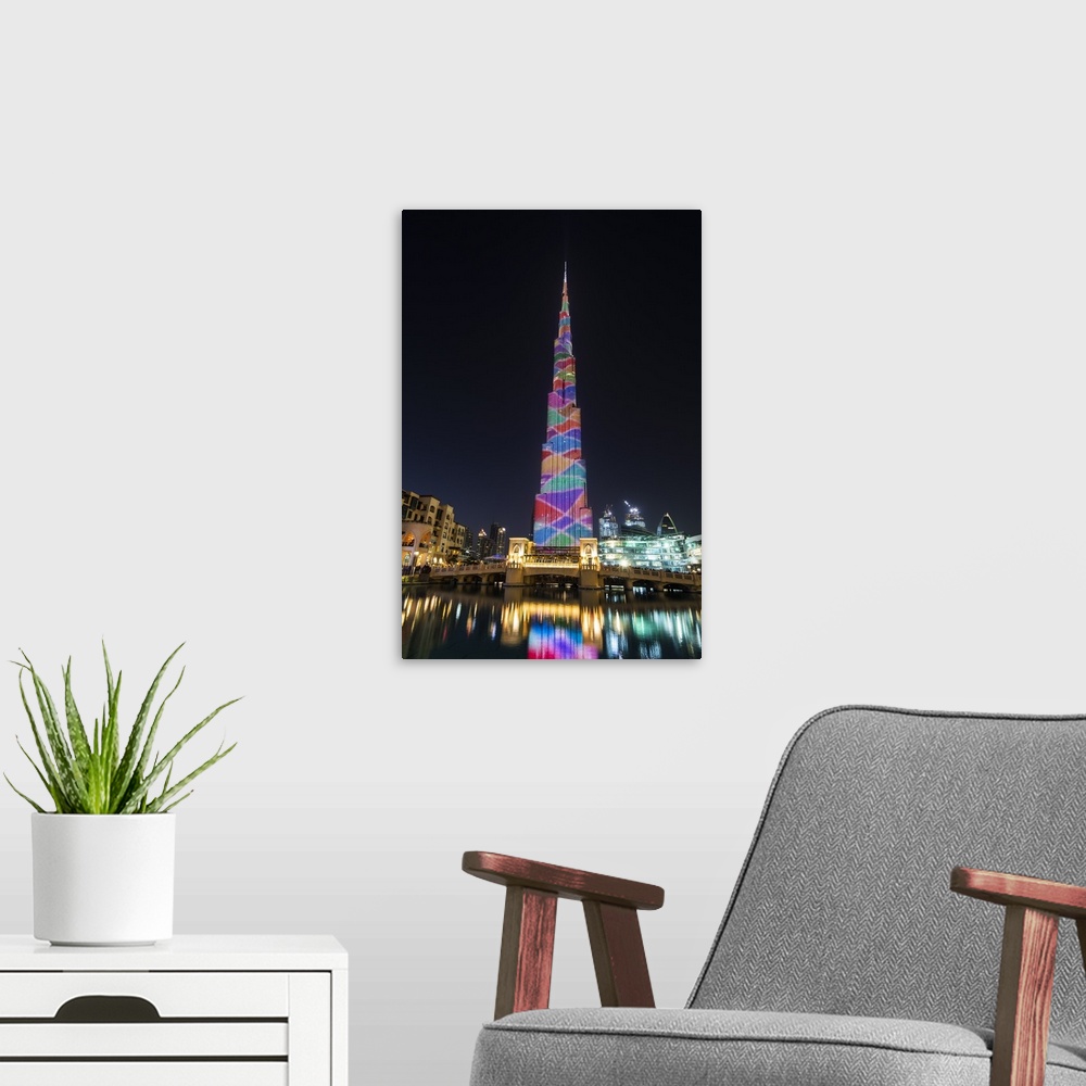 A modern room featuring Night view of LED light show on Burj Khalifa, Dubai, United Arab Emirates.