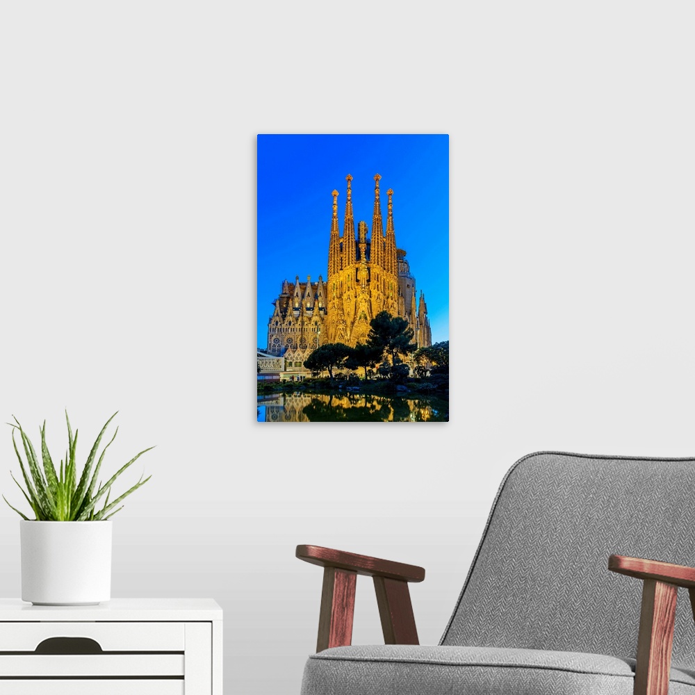 A modern room featuring Night view of the Nativity facade of Sagrada Familia basilica church, Barcelona, Catalonia, Spain