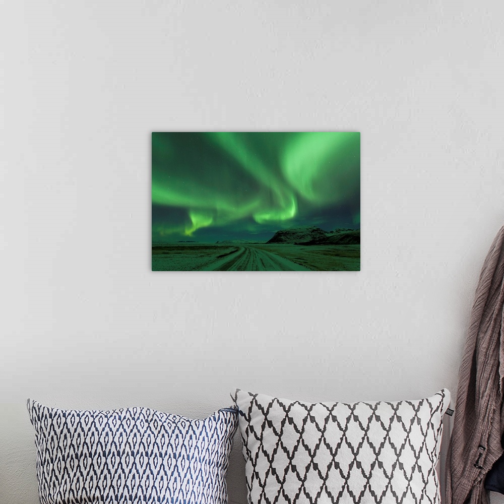 A bohemian room featuring Northern Lights, Aurora Borealis, Winter road with snow, Iceland