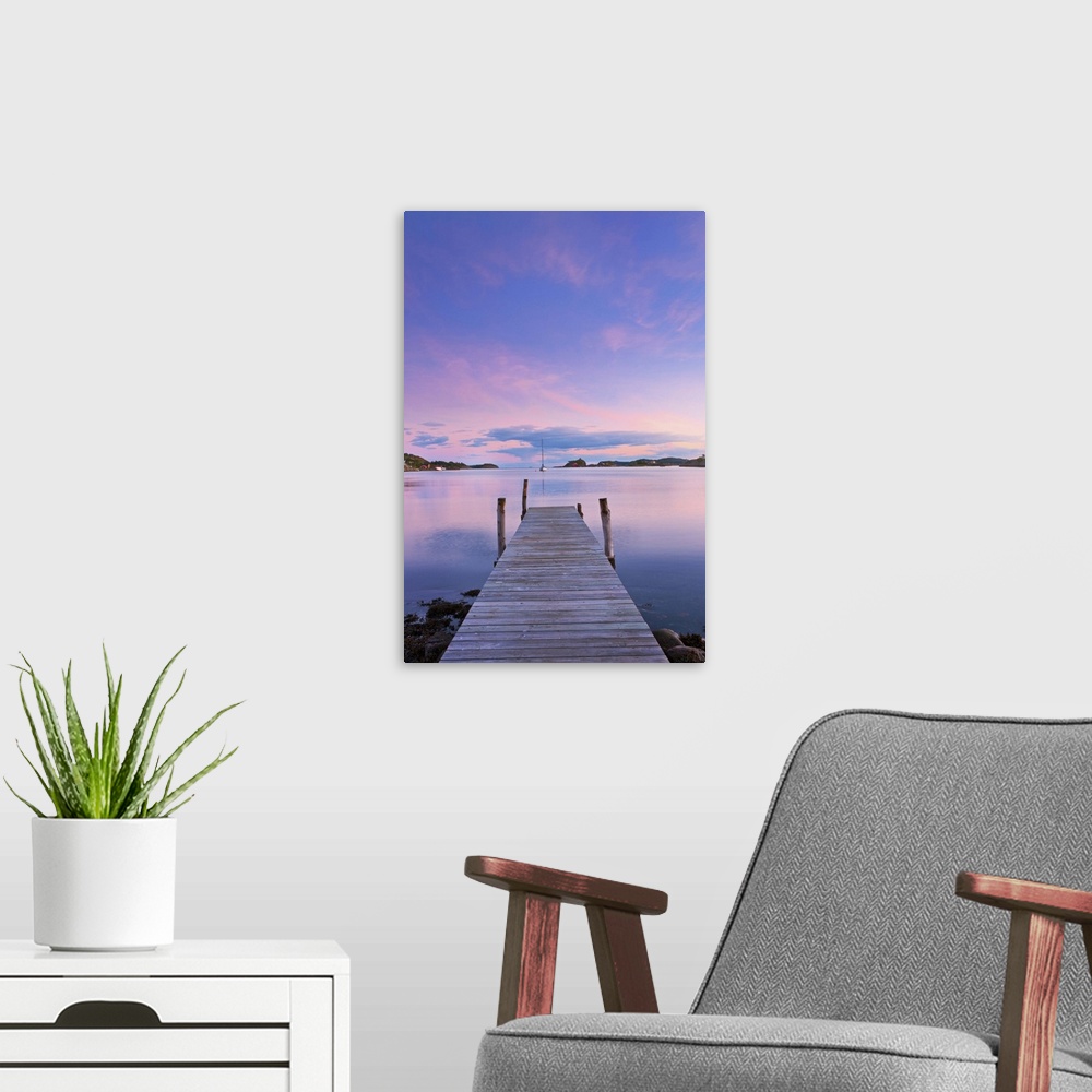 A modern room featuring Norway, Oslo, Oslo Fjord, jetty over lake at dusk
