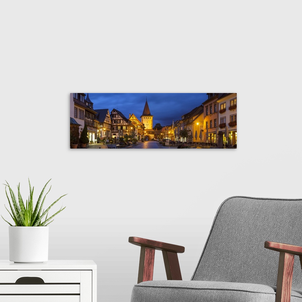A modern room featuring Oberturm Tower in Gengenbach's picturesque Altstad (Old Town) illuminated at dusk, Gengenbach, Ki...