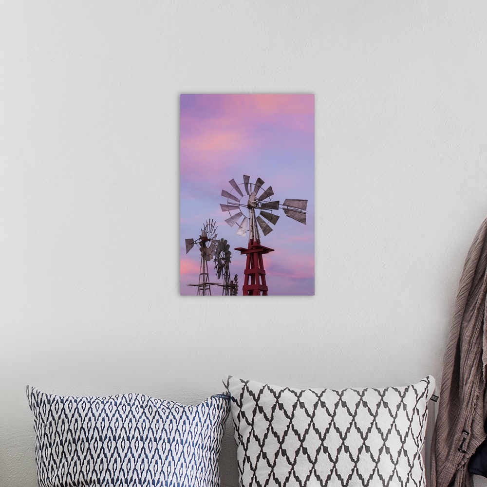 A bohemian room featuring USA, Oklahoma, Elk City, vintage farm windmills, dusk