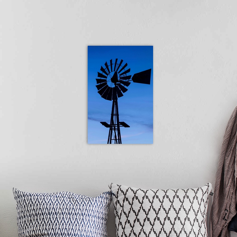 A bohemian room featuring USA, Oklahoma, Elk City, vintage farm windmills, dusk