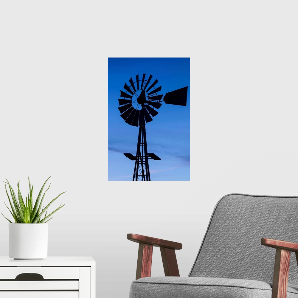 A modern room featuring USA, Oklahoma, Elk City, vintage farm windmills, dusk