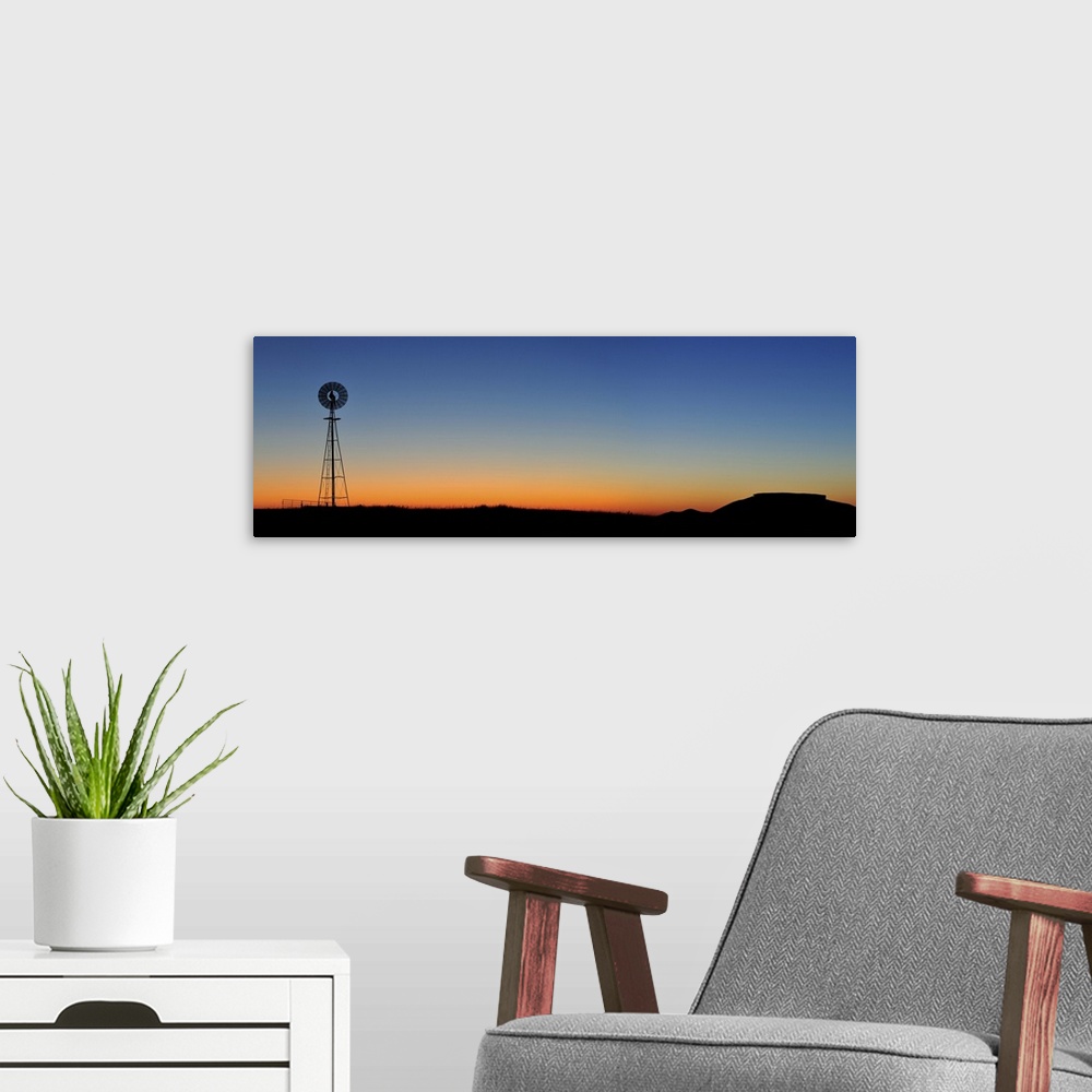 A modern room featuring Old west windmill at sunset, Pawnee National Grassland, Colorado, USA