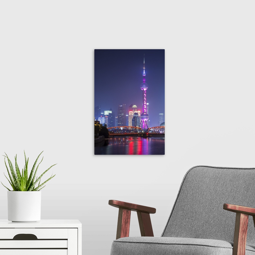 A modern room featuring Oriental Pearl Tower and Waibaidu bridge, Pudong, Shanghai, China.