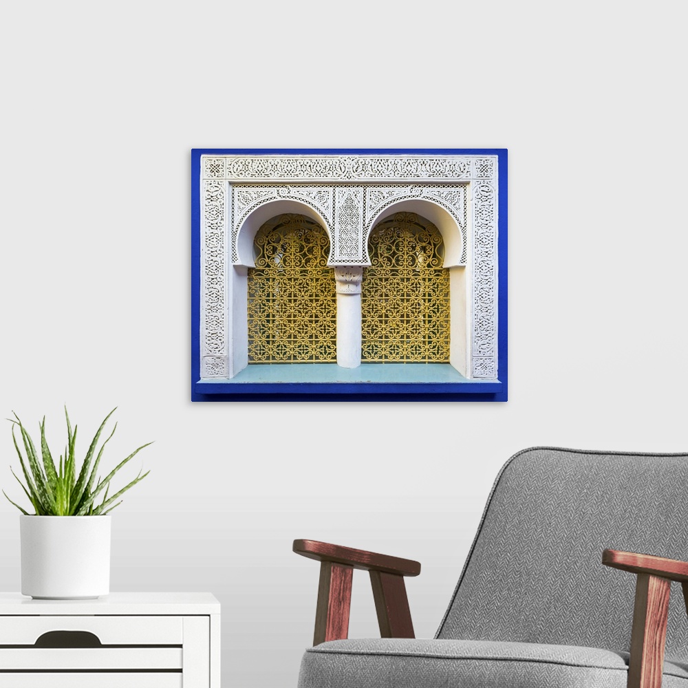 A modern room featuring Morocco, Marrakech-Safi (Marrakesh-Tensift-El Haouz) region, Marrakesh. Ornate window against blu...