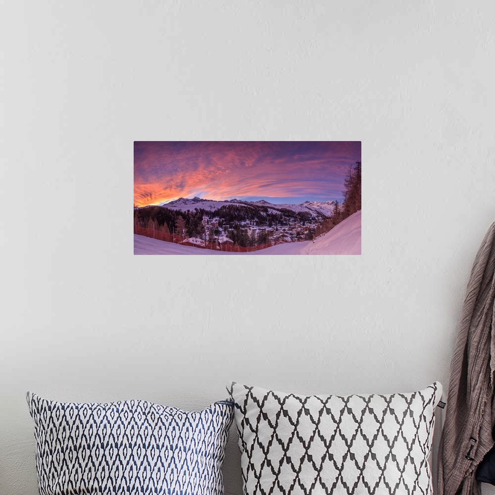 A bohemian room featuring Panorama of the alpine village of Madesimo and snowy ski slopes at sunset Spluga Valley Valtellin...