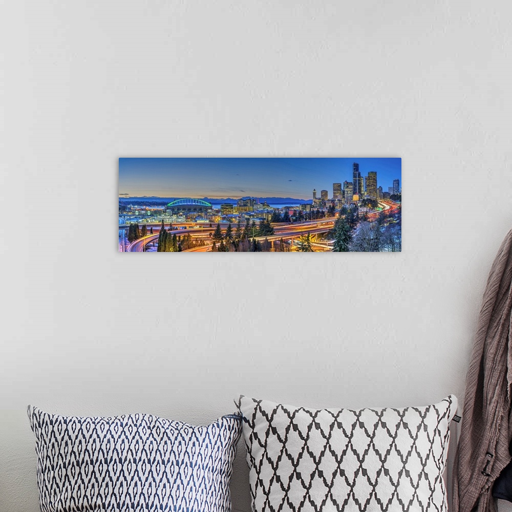 A bohemian room featuring Panoramic view over Downtown skyline with Interstate 5 at twilight, Seattle, Washington, USA.