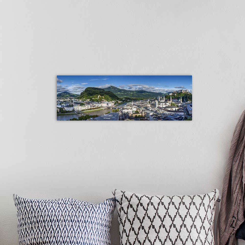 A bohemian room featuring Panoramic view over the old town and Hohensalzburg Castle at dusk, Salzburg, Austria