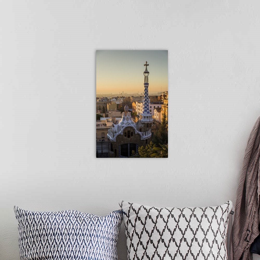 A bohemian room featuring Park Guell with city skyline behind at sunrise, Barcelona, Catalonia, Spain.