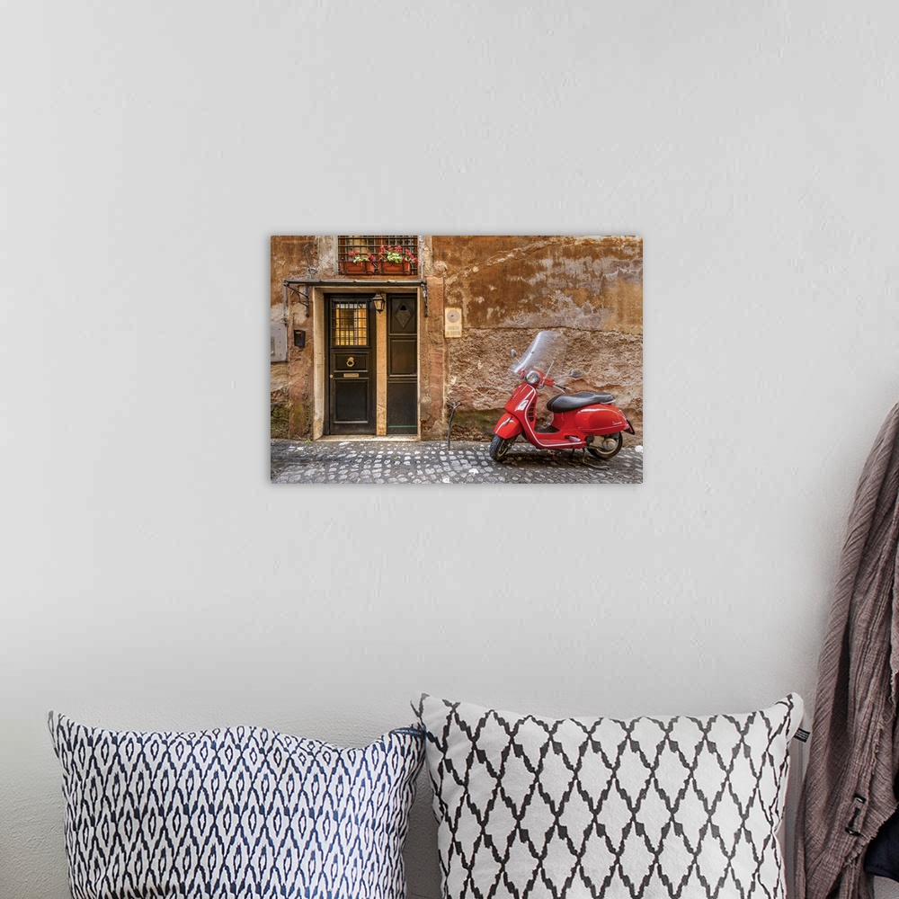 A bohemian room featuring Parked red Vespa scooter in a cobbled street of Rome, Lazio, Italy