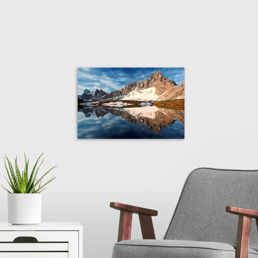 A modern room featuring Paterno mount (Paternkofel) and Crode of Piani reflected in the Piani Lake (Bodenseen), Dolomites...