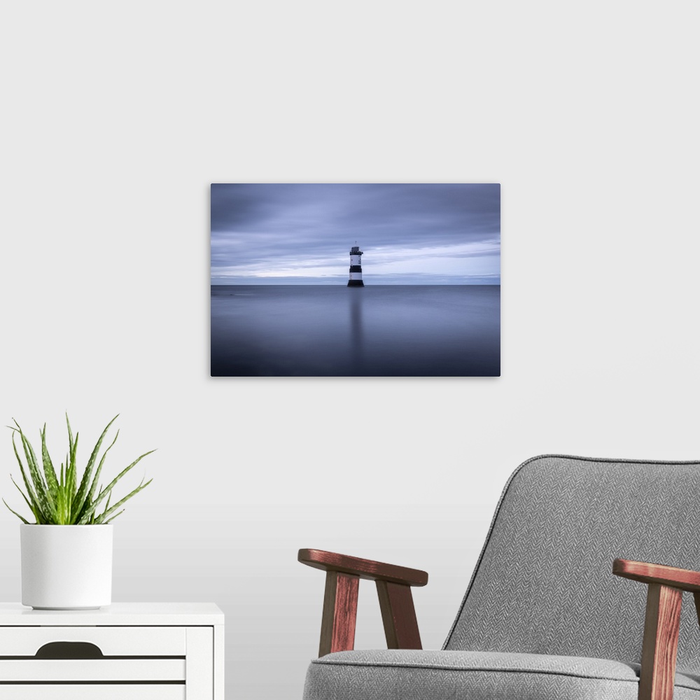 A modern room featuring Penmon Point Lighthouse seascape, Anglesey, Wales, UK. Autumn (September) 2019.