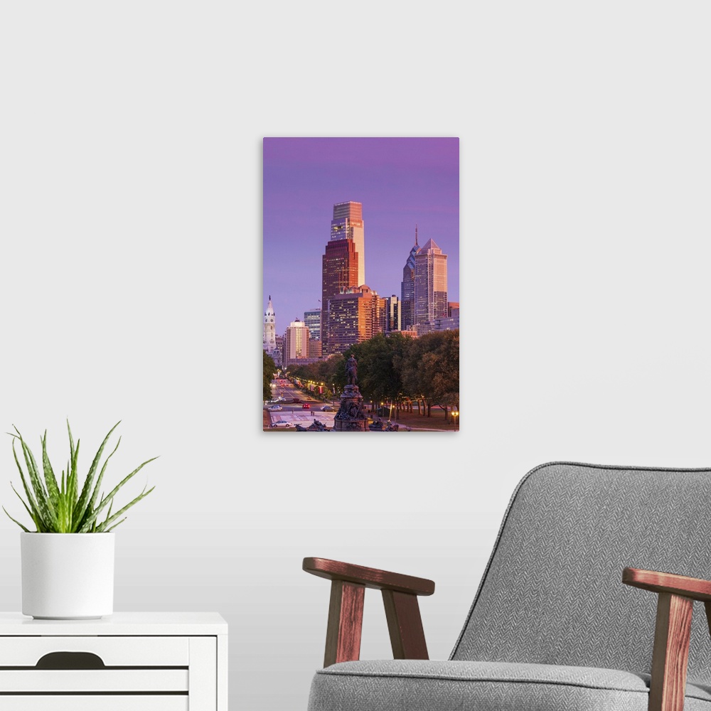 A modern room featuring USA, Pennsylvania, Philadelphia, city skyline from the Benjamin Franklin Parkway, dusk