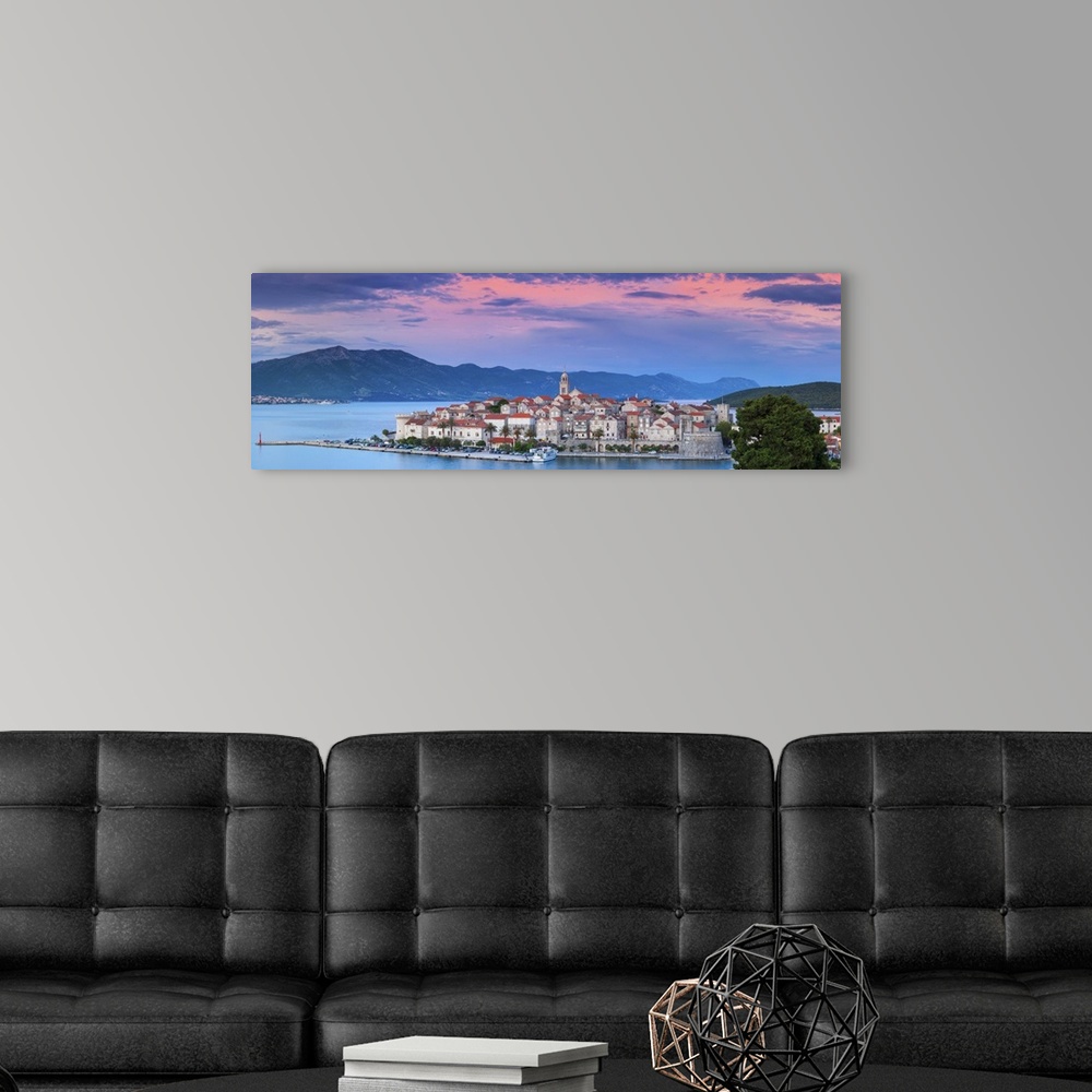 A modern room featuring Elevated view over picturesque Korcula Town illuminated at sunset, Korcula, Dalmatia, Croatia
