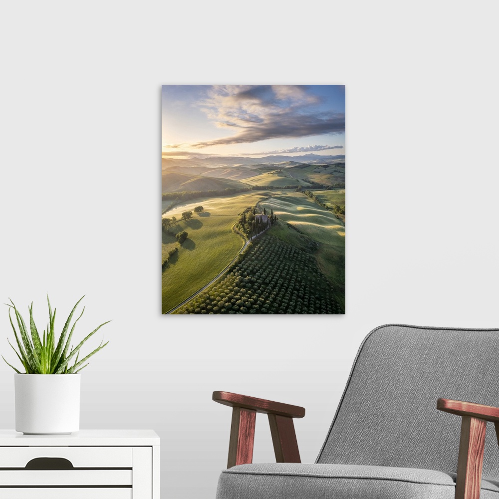 A modern room featuring Podere Belvedere and the surrounding countryside at sunrise. San Quirico d'Orcia, Val d'Orcia, Tu...