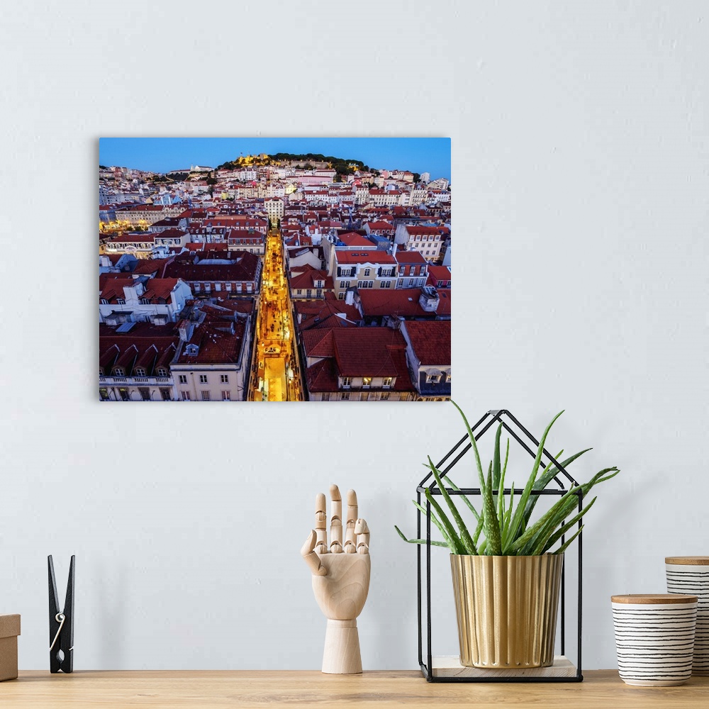 A bohemian room featuring Portugal, Lisbon, Miradouro de Santa Justa, Twilight view over downtown and Santa Justa Street to...