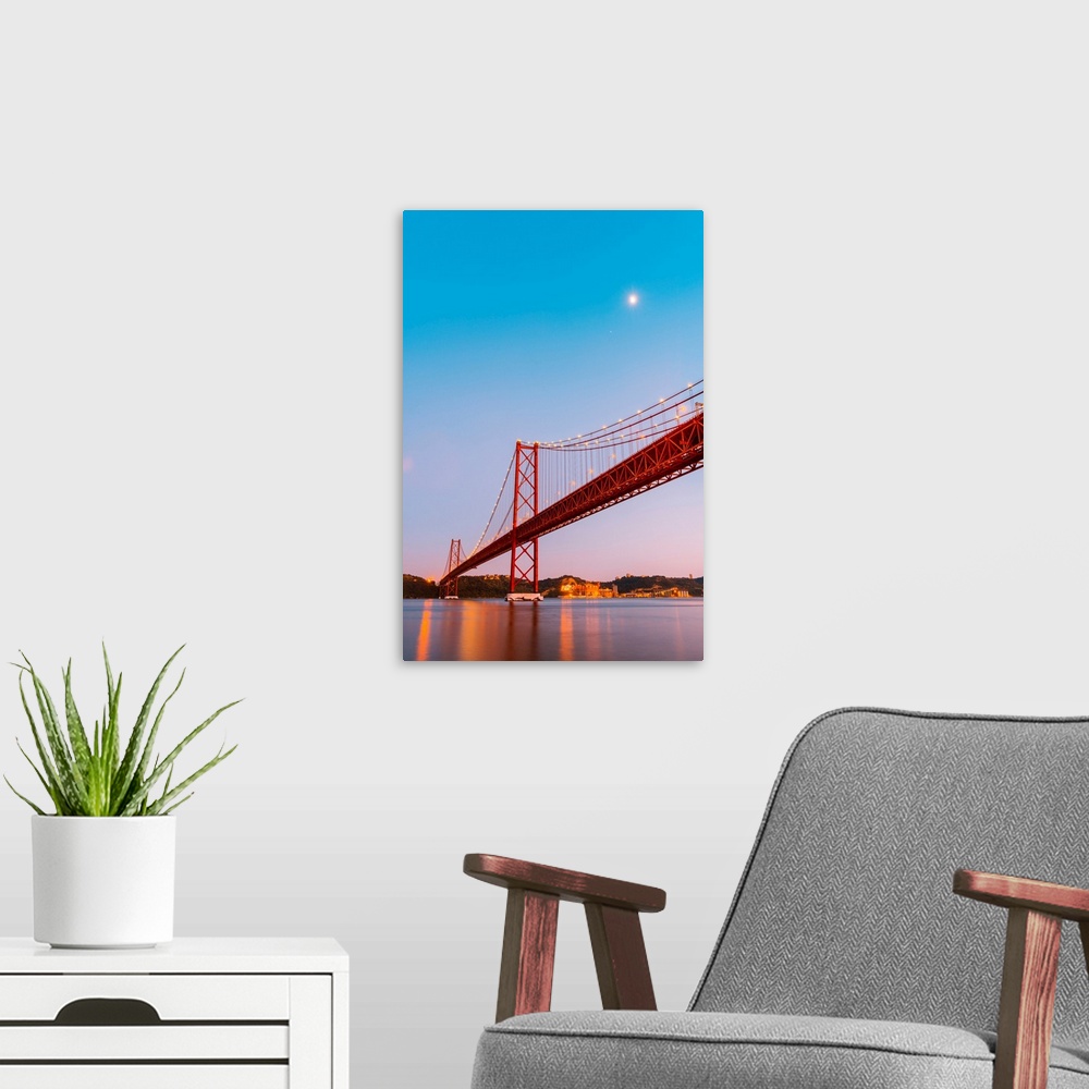A modern room featuring Portugal, Lisbon. The 25 de Abril Bridge across the Tagus river and Cristo Rei (Christ the King).
