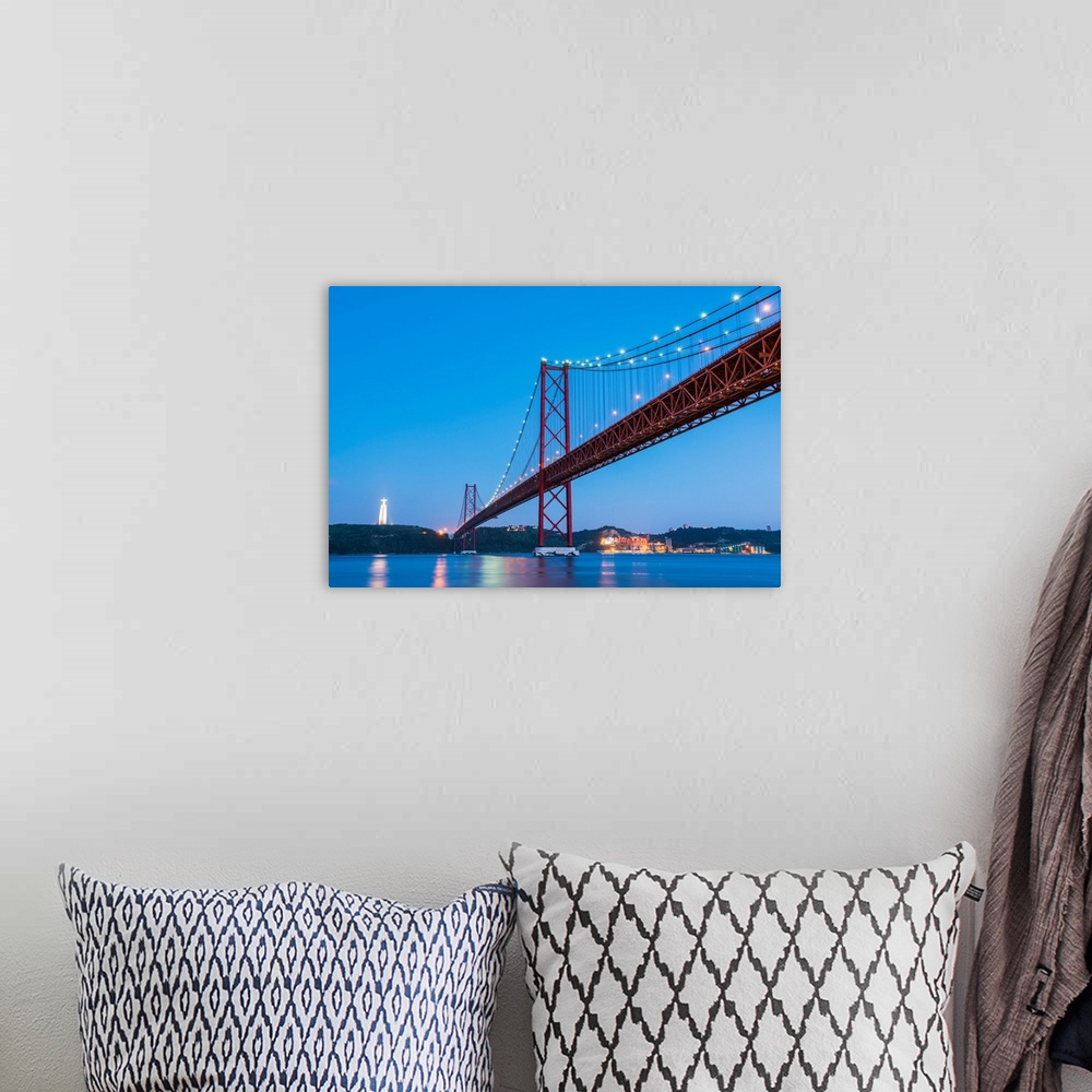 A bohemian room featuring Portugal, Lisbon. The 25 de Abril Bridge across the Tagus river and Cristo Rei (Christ the King).