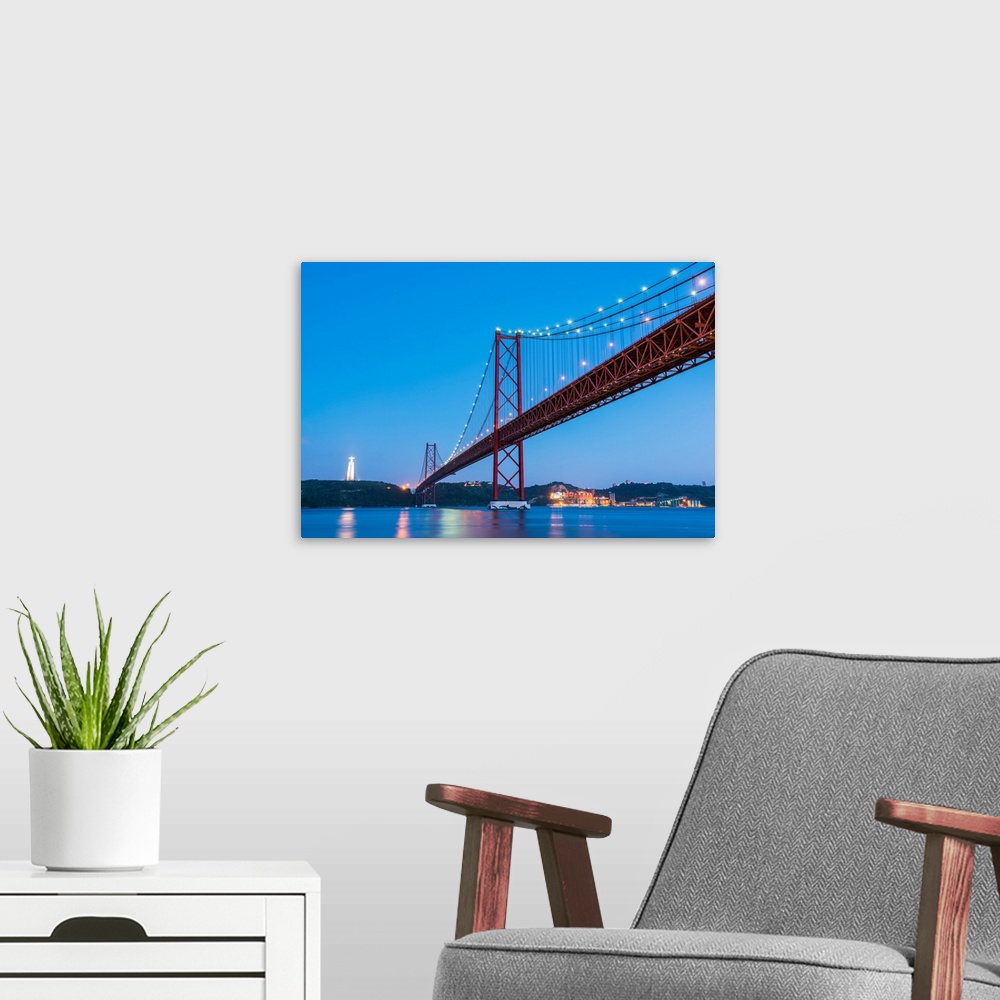 A modern room featuring Portugal, Lisbon. The 25 de Abril Bridge across the Tagus river and Cristo Rei (Christ the King).