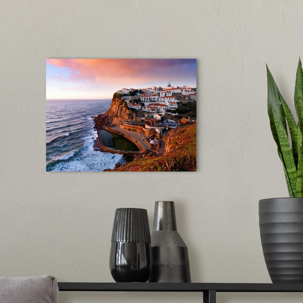A modern room featuring Portugal, Sintra, Azehas do Mar, Overview of town at dusk