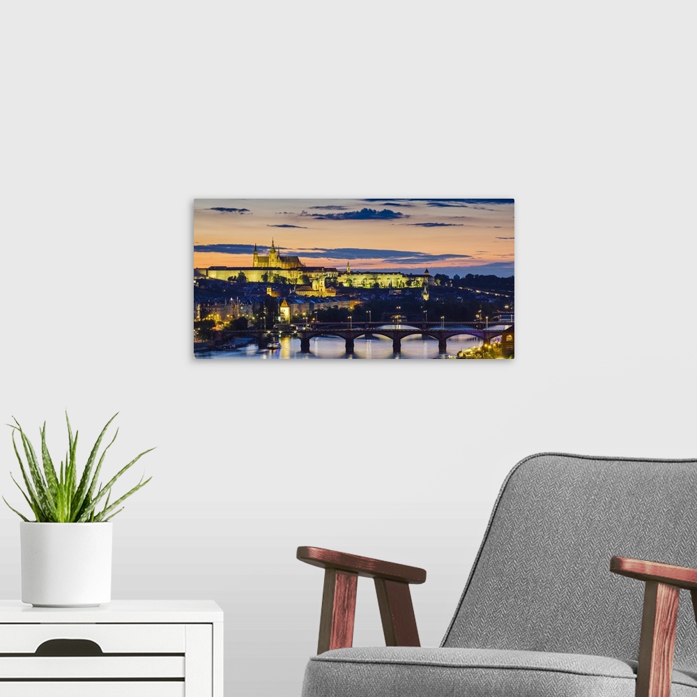 A modern room featuring Czech Republic, Prague. Prague Castle, Pazsky Hrad, and the Vltava River at sunset from the Vyseh...