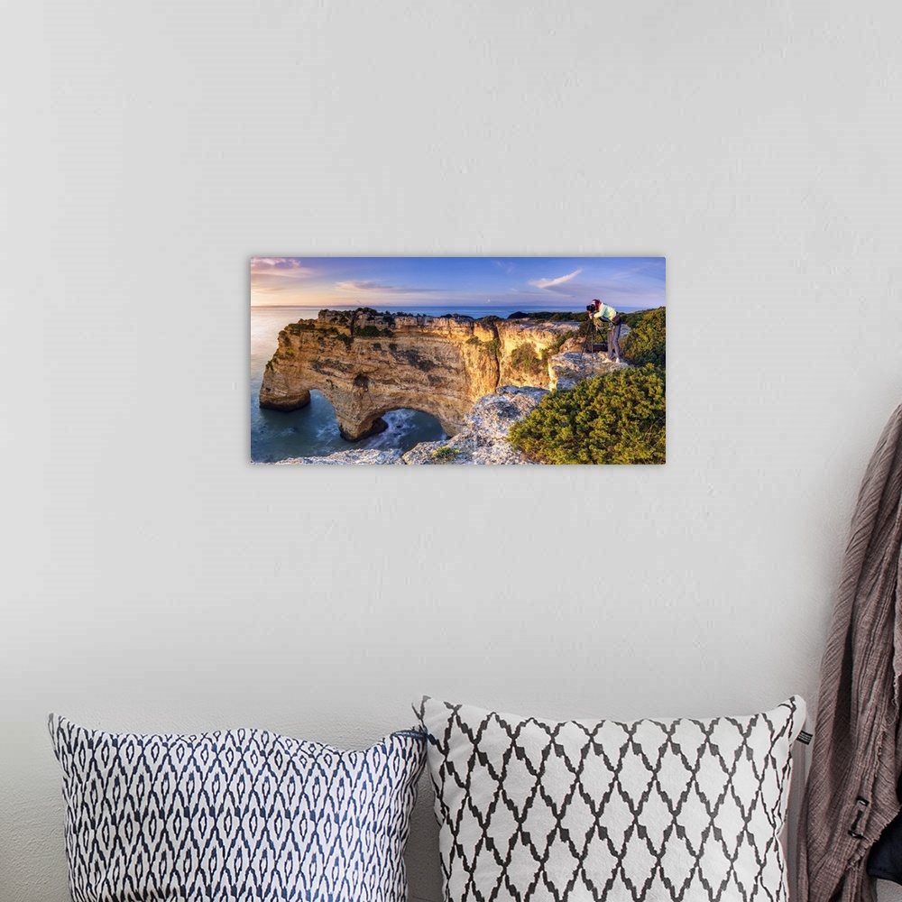 A bohemian room featuring Praia de Marinha, Caramujeira, Lagoa, Algarve, Portugal. Panoramic view of a woman photographing ...
