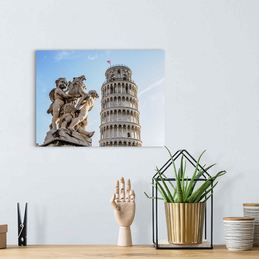 A bohemian room featuring Putti Fountain and Leaning Tower, Piazza dei Miracoli, Pisa, Tuscany, Italy.
