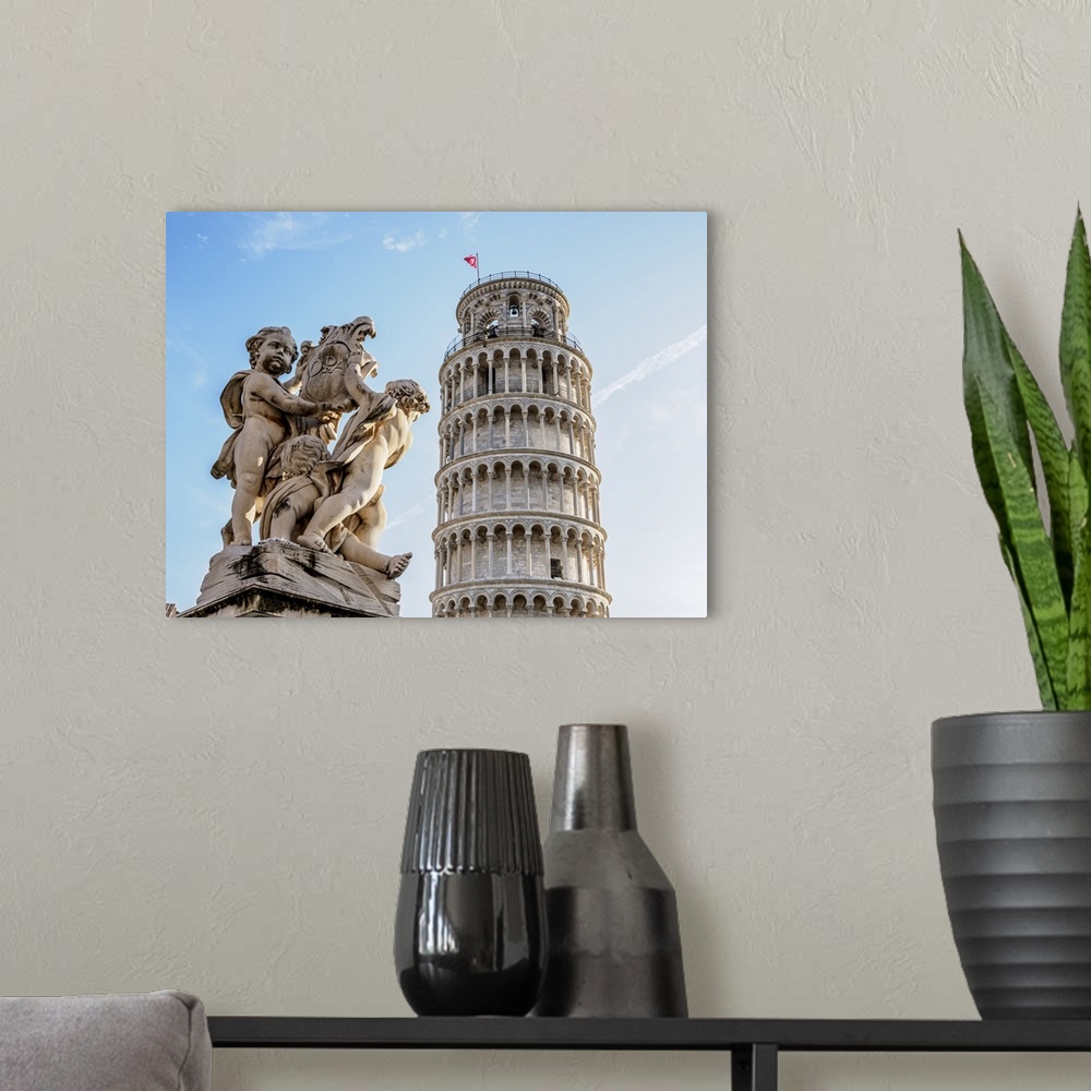 A modern room featuring Putti Fountain and Leaning Tower, Piazza dei Miracoli, Pisa, Tuscany, Italy.