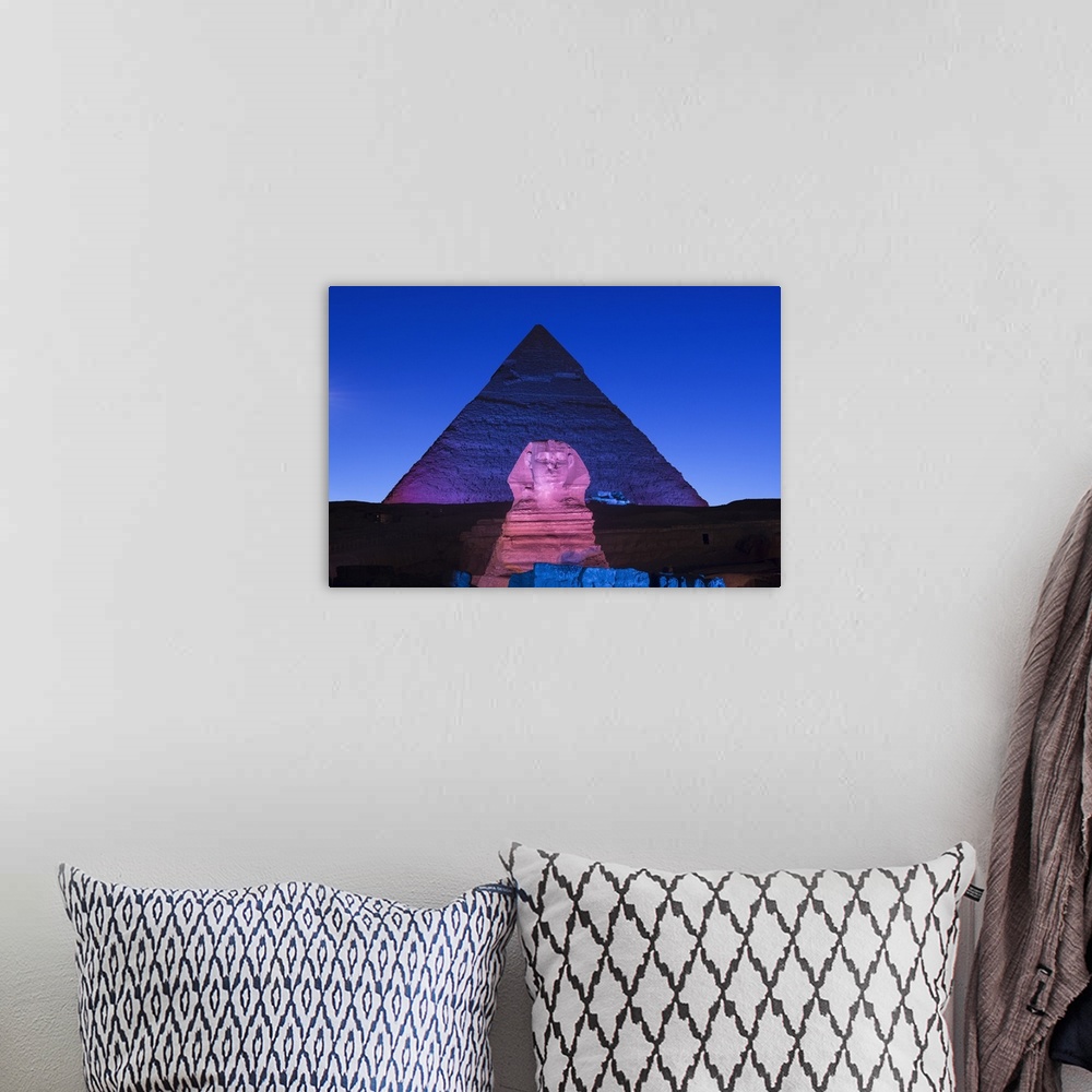 A bohemian room featuring Pyramid of Khafre (Chephren) and the Sphinx at night, Giza, Cairo, Egypt.