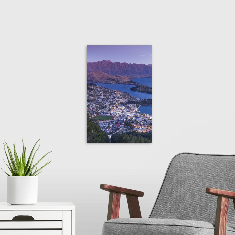 A modern room featuring New Zealand, South Island, Otago, Queenstown, elevated town view with The Remarkables from the Sk...