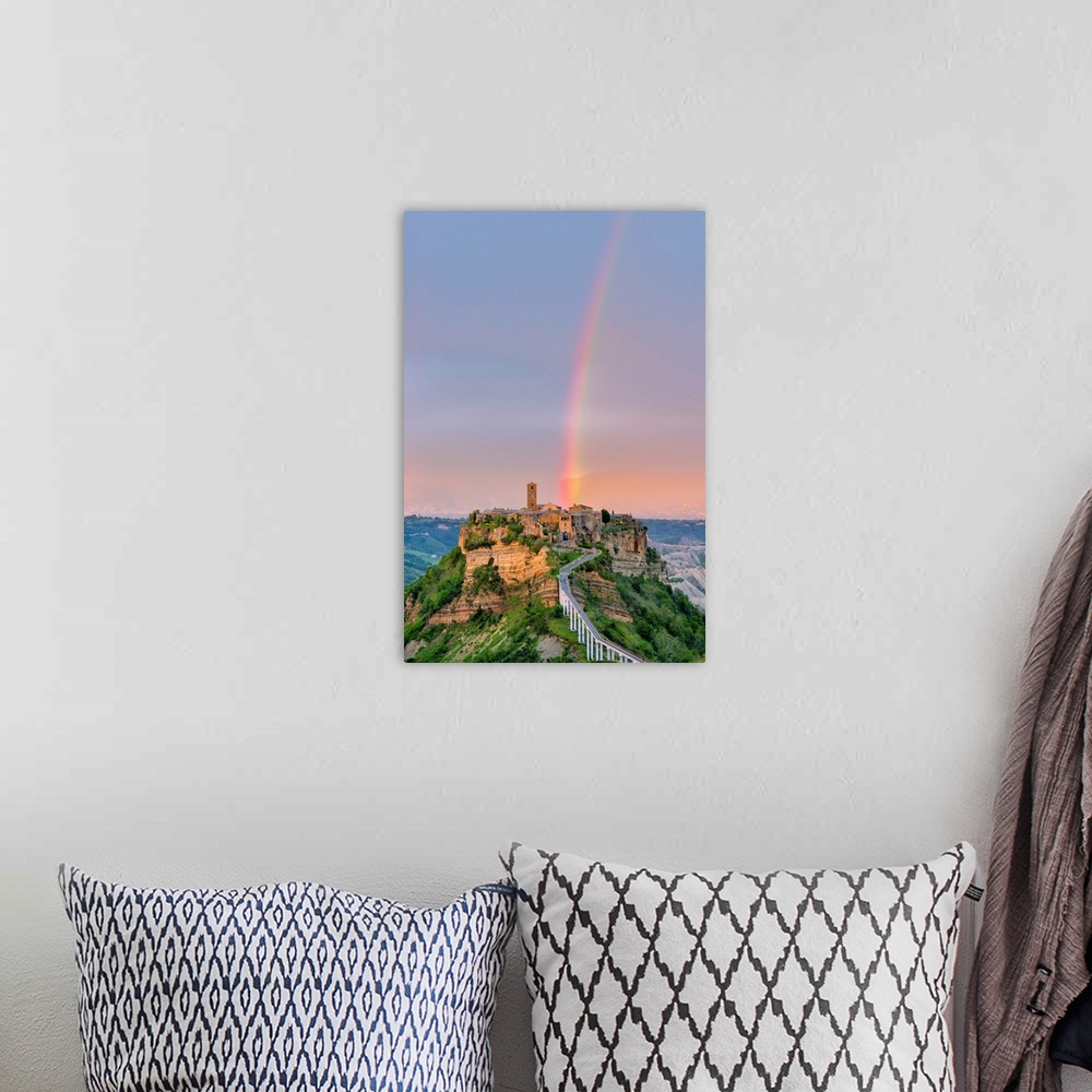 A bohemian room featuring Rainbow over Civita di Bagnoregio at sunset, Bagnoregio, Lazio, Italy, Europe.