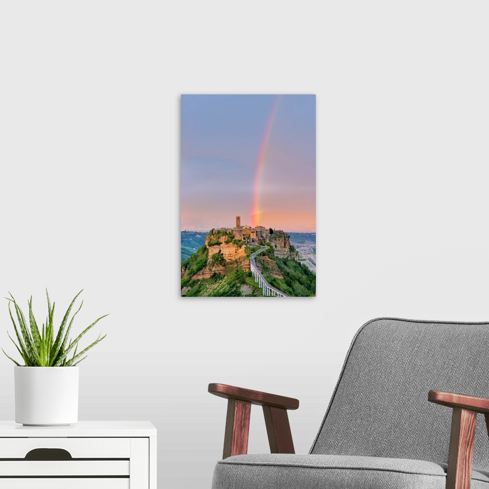 A modern room featuring Rainbow over Civita di Bagnoregio at sunset, Bagnoregio, Lazio, Italy, Europe.