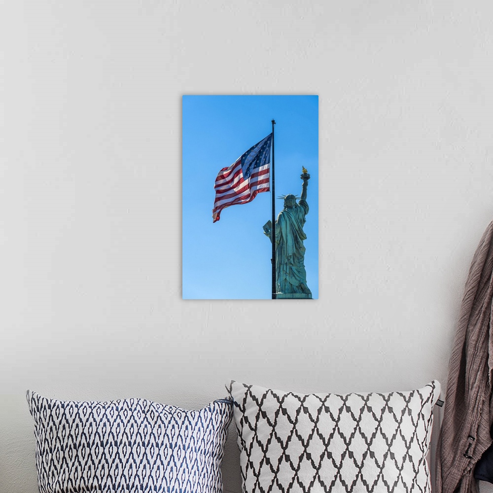 A bohemian room featuring Rear side of Statue of Liberty with US flag, Liberty Island, New York, USA