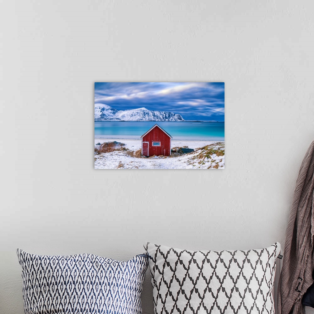 A bohemian room featuring Red Cabin On Ramberg Beach, Lofoten Islands, Norway