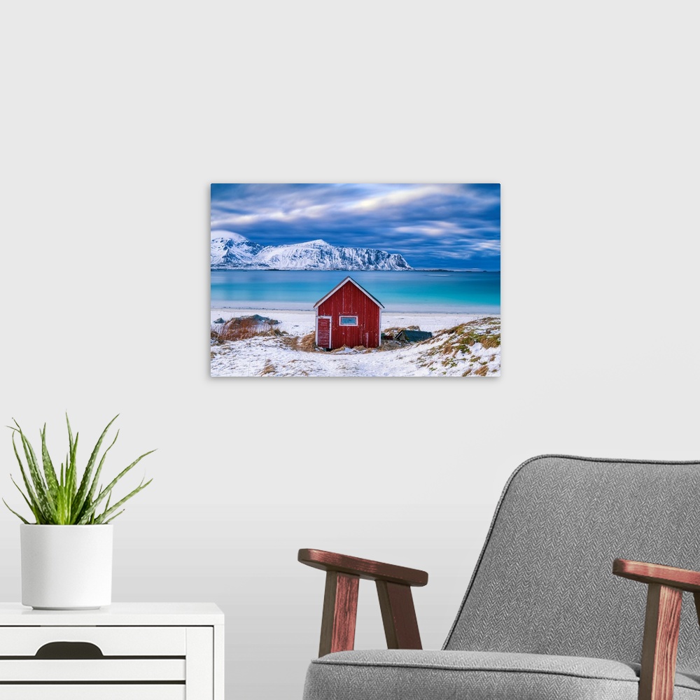 A modern room featuring Red Cabin On Ramberg Beach, Lofoten Islands, Norway